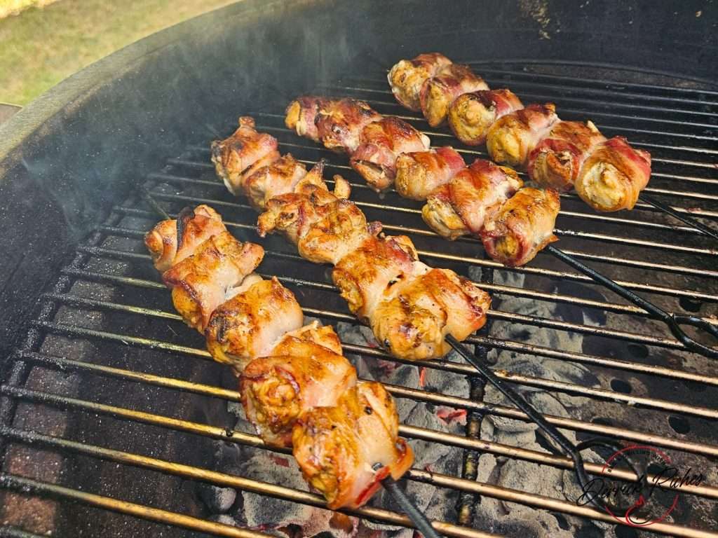 bacon wrapped chicken skewers on the grill